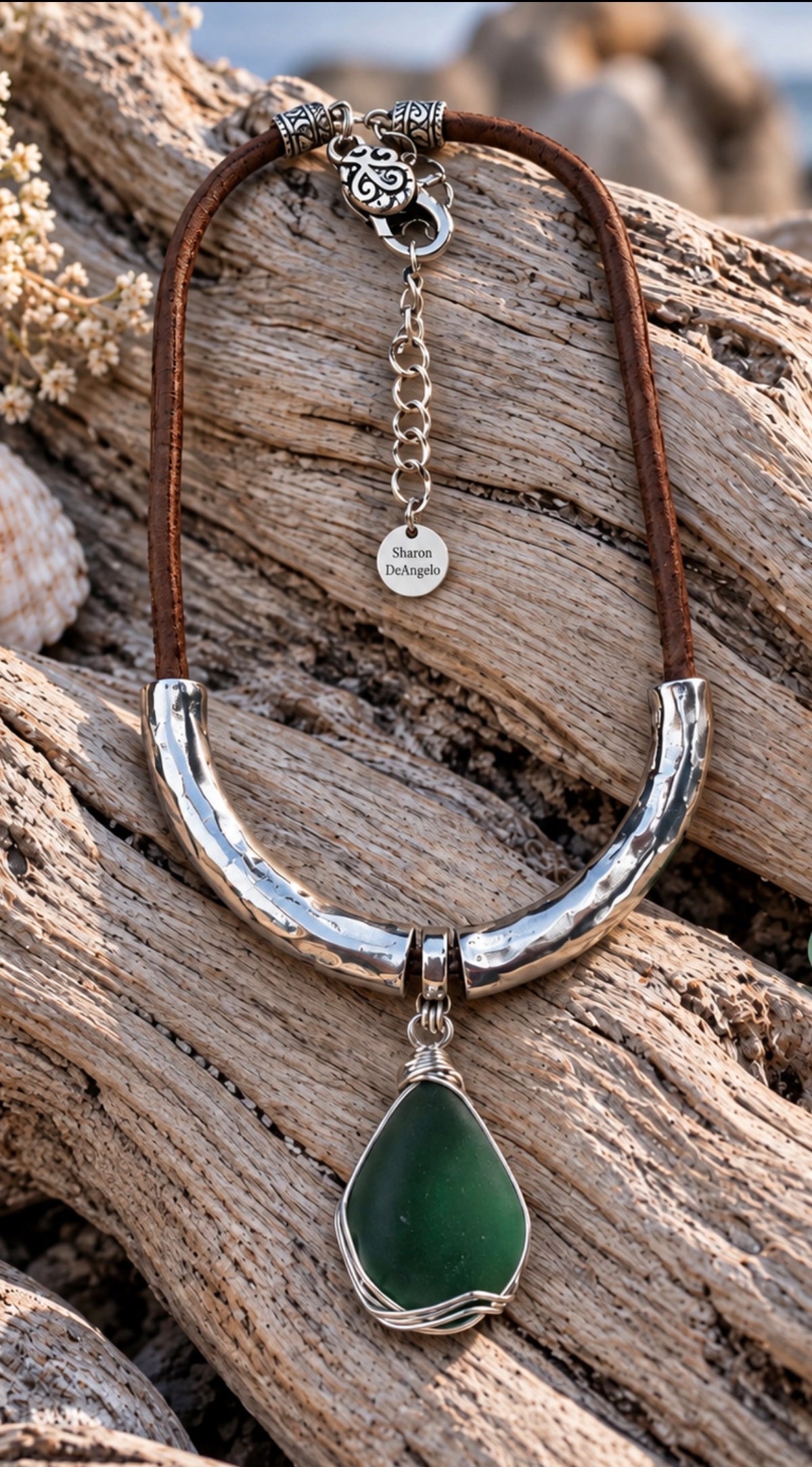 Deep green sea glass statement necklace on driftwood