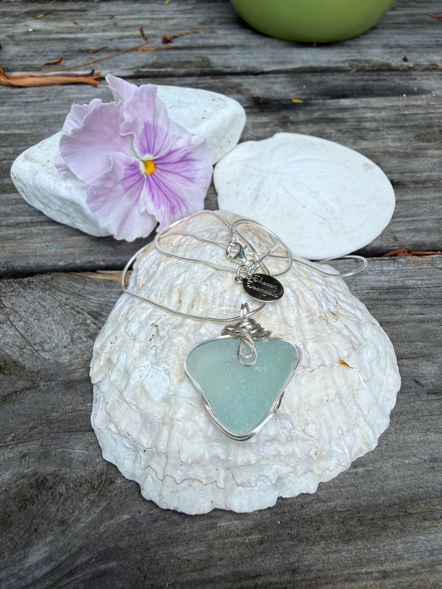 Natural heart sea glass pendant on shell with flower