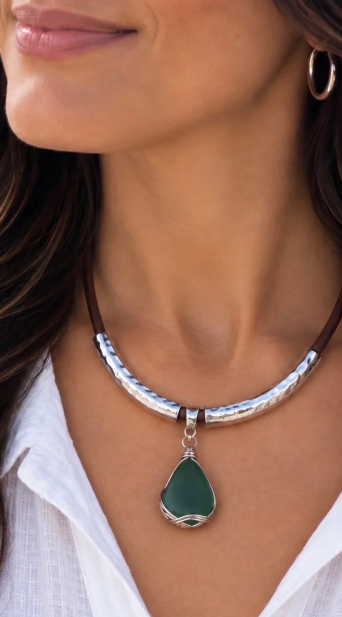 Close-up of model wearing the deep green sea glass statement necklace