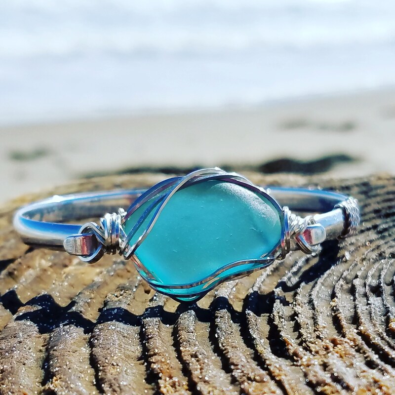 Blue Bracelet in front of Ocean