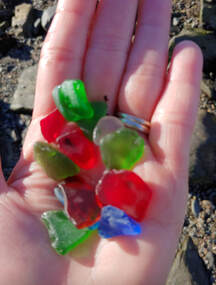 colored sea glass in palm of hand
